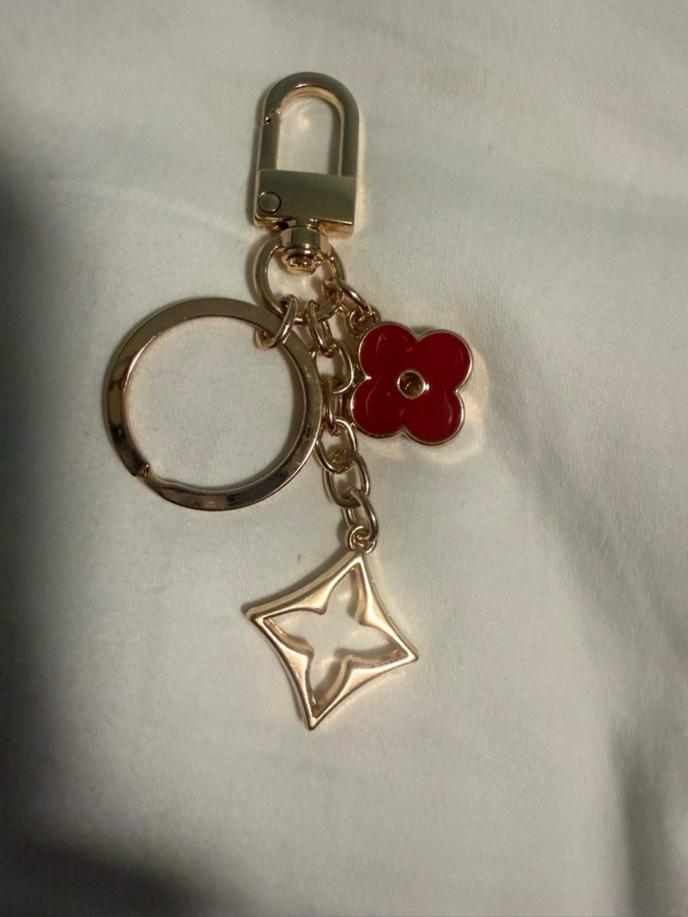 KeyChain with a hook for Bags with Red Flower Charm and gold tone accents!